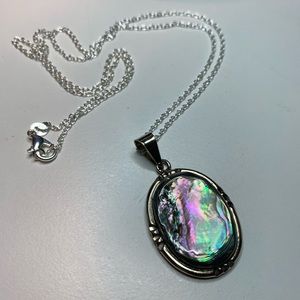 Oval Abalone and German Silver pendant in a chain.